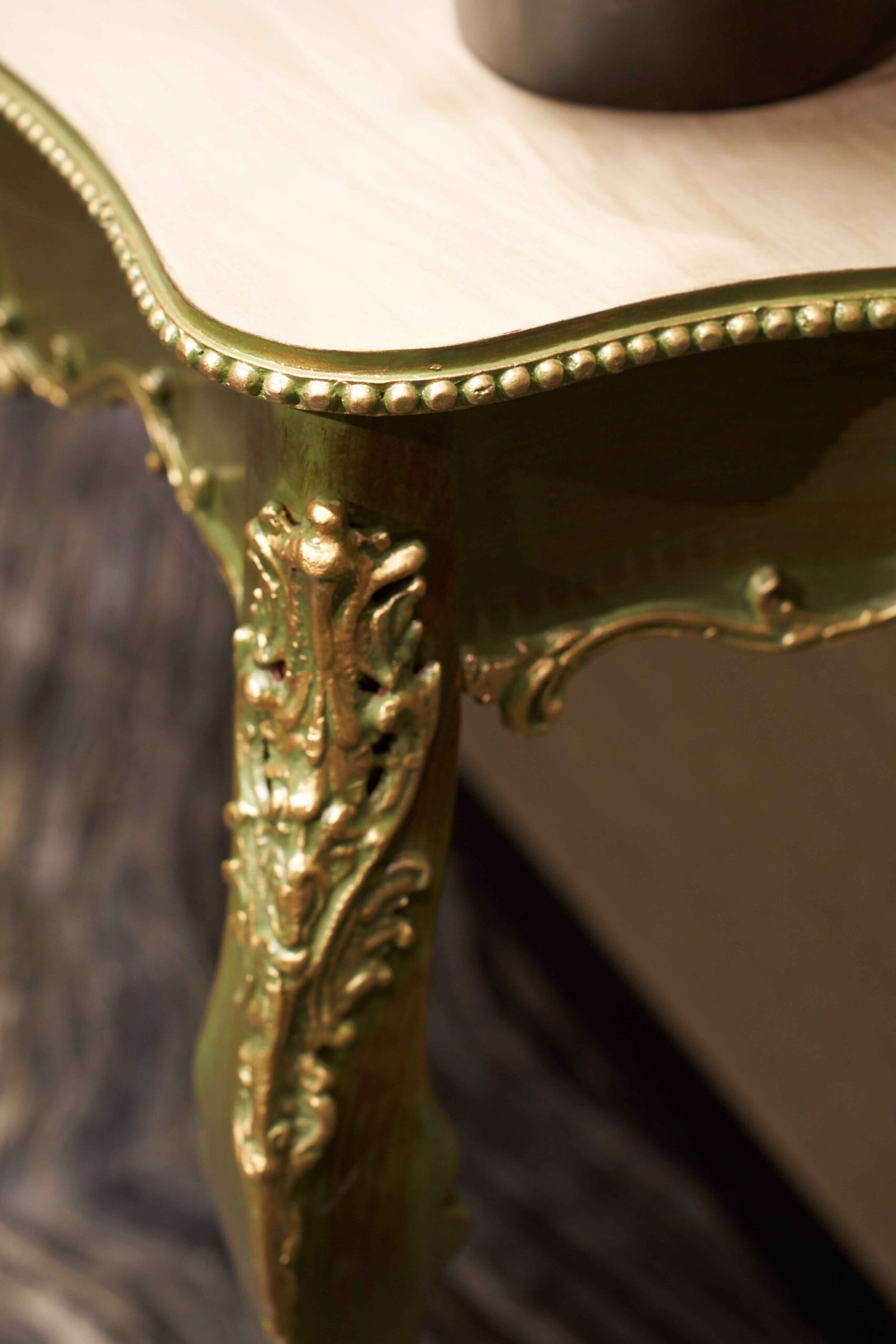 Gold carved furniture detail captured in dramatic light
