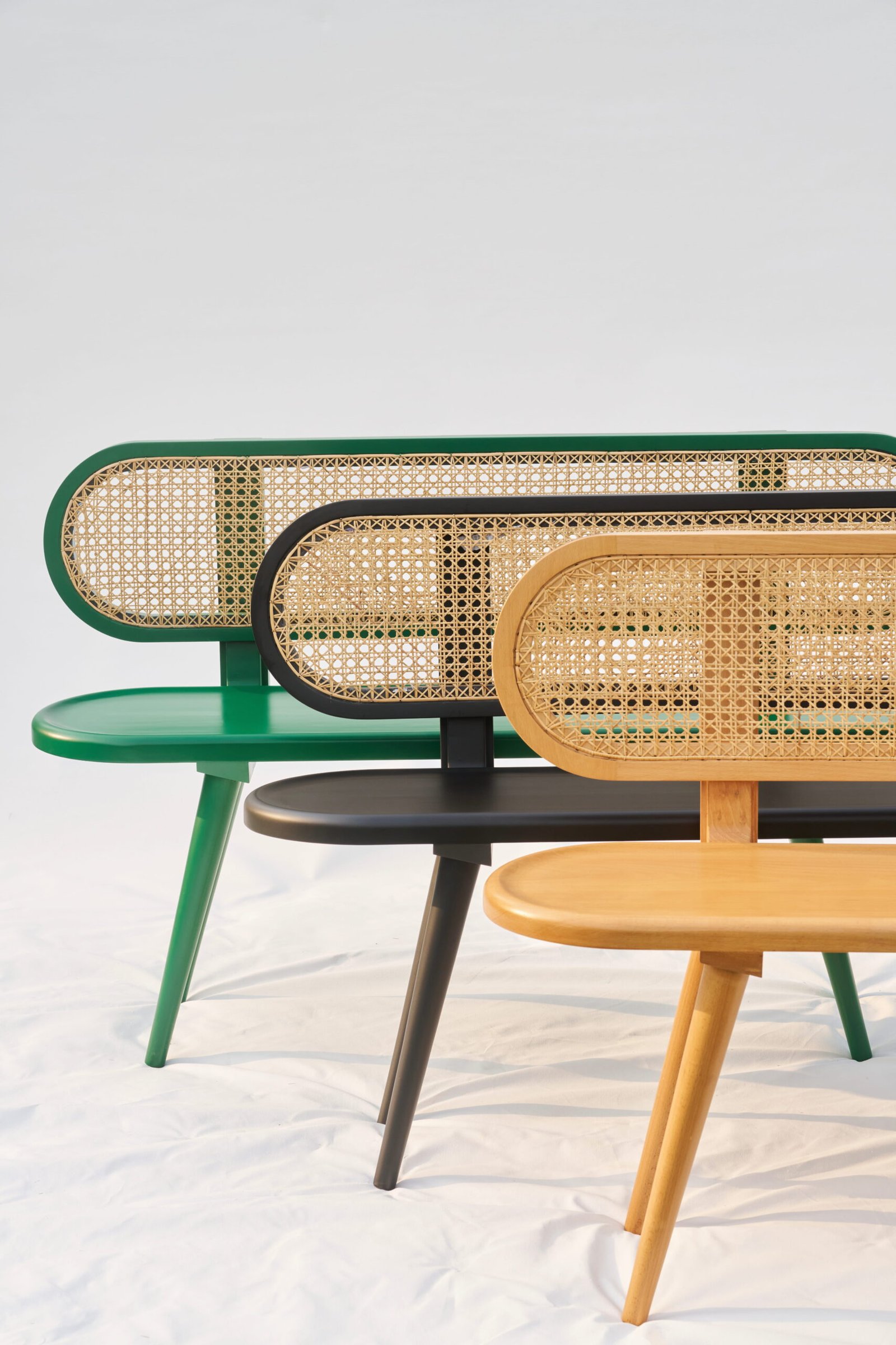 Three contemporary cane benches photographed in studio by Faizan Mir