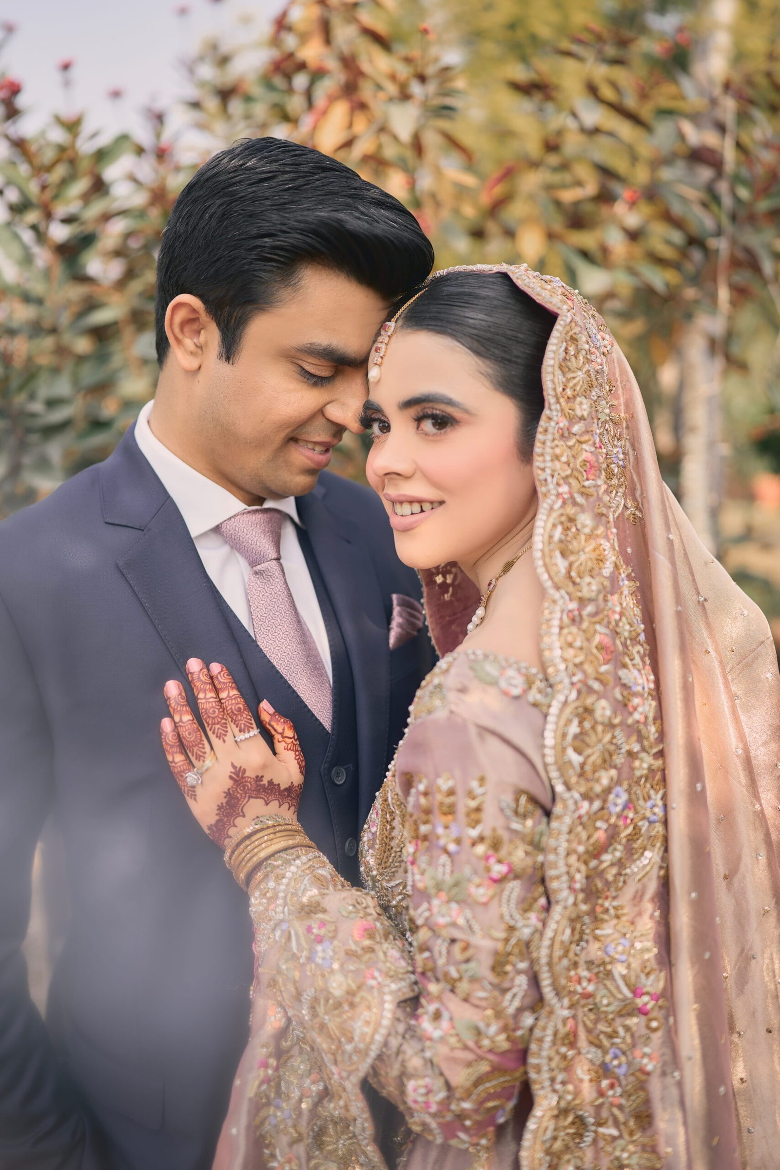 Bride and groom celebrating together in an elegant wedding portrait